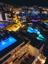 modern swimming pool with blue water illumination on hotel roof top, Tenerife Royalty Free Stock Photo