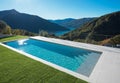 Modern swimming pool in the garden with lake and valley view