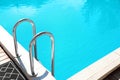 Modern swimming pool with step ladder Royalty Free Stock Photo