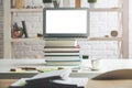 Modern table with empty white laptop screen Royalty Free Stock Photo