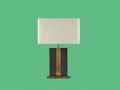A modern table lamp with a rectangular linen shade and a dark wood base with a central gold stripe Royalty Free Stock Photo