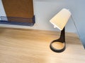 Modern table lamp on table. Workplace, Copy space