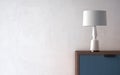 Modern table light on nightstand in empty bright room