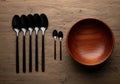 Modern table setting with wooden bowl and spoons Royalty Free Stock Photo
