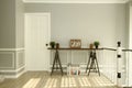 Modern table at top stair landing, light and breezy feel