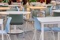 Modern tables and blue chairs in shopping malls