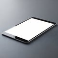Modern tablet device with blank screen on a dark surface Royalty Free Stock Photo