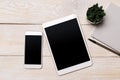 Top view of white tablet blank black screen for advertisement display or other app design with smartphone Royalty Free Stock Photo