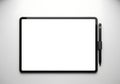 Modern tablet with stylus on a light gray surface top view professional digital device Royalty Free Stock Photo