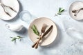 Modern tableware, overhead flat lay shot with olive branches
