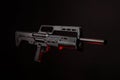 Modern tactical pump action shotgun on a dark back. Red backlight