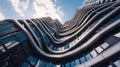 Modern tall building with wavy futuristic design, low angle view of abstract curve shapes and sky. Geometric facade with glass and Royalty Free Stock Photo