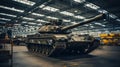 Modern tank in factory, armored vehicle stored in military plant. Interior of industrial warehouse or hangar. Concept of