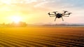 Modern technologies in agriculture. Industrial drone flies over a green field and sprays useful pesticides to increase