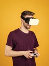 Modern technologies. man wear wireless VR glasses. guy play video games. game player with console. male in VR headset Royalty Free Stock Photo