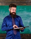 Modern technology education. Start lesson. Teacher bearded man with modern laptop chalkboard background. Hipster teacher