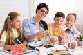 Kids creating robots with teacher at stem education class Royalty Free Stock Photo