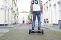 Modern technology, a man is riding on a blackboard. Close Up of Dual Wheel Self Balancing Electric Skateboard Smart. on electrical Royalty Free Stock Photo