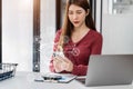 Modern technology and networking concept, woman using laptop, tablet and smartphone with virtual screen API icon Software Royalty Free Stock Photo