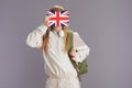 modern teen girl in beige tracksuit with backpack