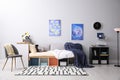 Modern teenager`s room with comfortable bed and stylish design elements Royalty Free Stock Photo