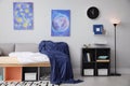 Modern teenager`s room interior with comfortable bed and stylish design elements Royalty Free Stock Photo