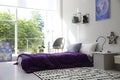Modern teenager`s room interior with bed and stylish design elements Royalty Free Stock Photo