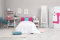 Modern teenager`s room interior with comfortable bed and workplace Royalty Free Stock Photo