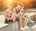 Teenagers with phones absorbed in online communication