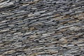 Modern thin slate stone layered wall texture pattern background.