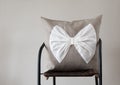 Throw pillow with white bow for home decor