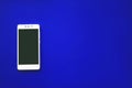 Modern Touch Screen Phone on blue background, for the design or cell phone mockup Royalty Free Stock Photo