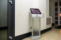 A modern touch screen terminal for customer service, an electronic queue in the service sector. Using a self-service kiosk or a