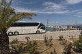 Modern tour bus on the seafront in Sitia an eastern Crete resort. Royalty Free Stock Photo