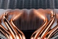 Modern tower heat radiator with six copper heatpipes close-up macro background. Royalty Free Stock Photo