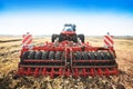Modern tractor in the field with complex for the treatment and plowing of soil.