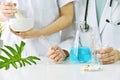 Modern and traditional medical, Alternative organic herbal drug and chemical medicine, Doctor mixing extraction for new pharmacy. Royalty Free Stock Photo