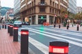 Modern traffic lights posts on pedestrian crossing