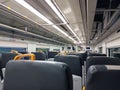Modern Train Interior with Empty Seats and Bright Overhead Lighting Royalty Free Stock Photo