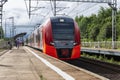 Modern train on the platform on a sunny day. Moscow, Russia, 07-02-2021 Royalty Free Stock Photo