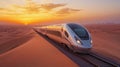 A Modern Train Traveling Through a Desert Landscape at Sunset Royalty Free Stock Photo