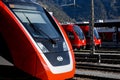 Modern trains of the rhÃÂ¤tische bahn and the swiss sbb at landquart Royalty Free Stock Photo