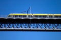 Modern tram on a steel bridge