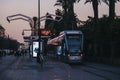 Modern tram at a stop on a street in Seville, Spain, at night Royalty Free Stock Photo