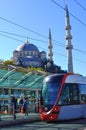 Modern Tram with Traditional Mosque in the backgroup