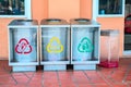 Modern transparent containers with signs for separate garbage and biodegradable waste. Urban waste separate collection system.