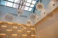 Modern transparent glass ceiling roof, modern chandeliers - roof top room design concept in daylight and blue sky