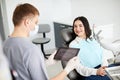 Male dentist with digital tablet. Modern treatment in professional dental clinic