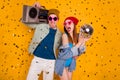 Modern trend two people students enjoy party hold cassette record boom box disco ball confetti fall fly wear denim jeans