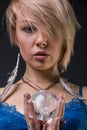 Modern Tribal Gypsy girl holding a crystal